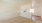 an empty room with a built in breakfast bar