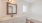 a bathroom with a sink white counters a toilet and a shower
