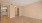an empty room with two entryways